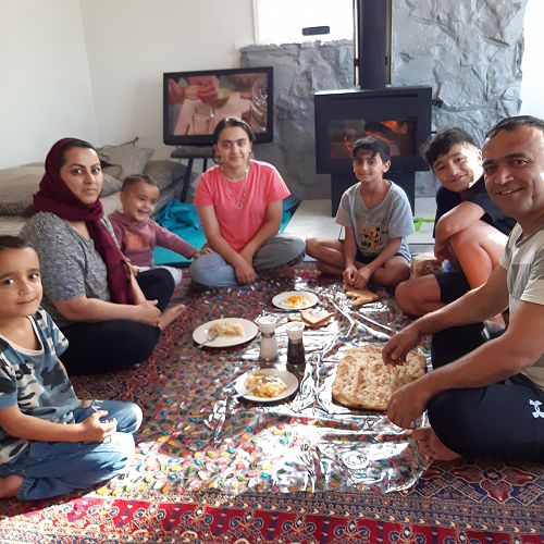 The Kazimi family enjoying their first breakfast in their new home