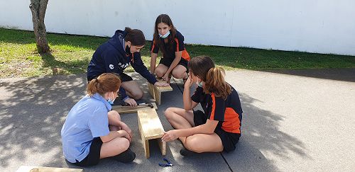 Year 9 Wairere students Amy Eason, Charlee Cox, Jade Farrant and Abigail O'Reilly constructing their trap boxes.