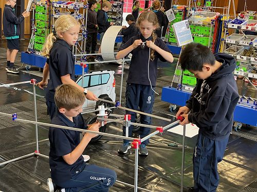 The Year 6 team work together to build their carwash frame