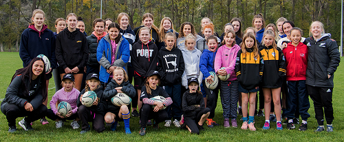 Stacey Waaka and Kendra Cocksedge pose with a great group of female rugby ambassadors.