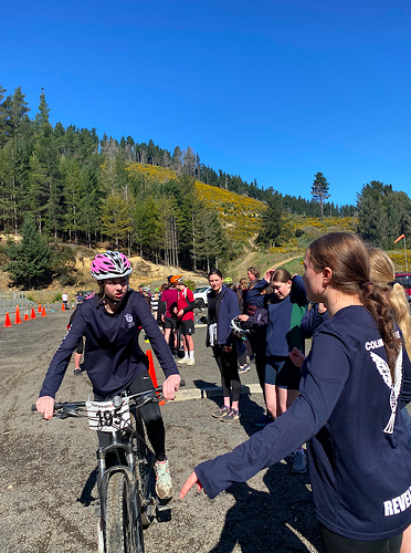 Kate McGowan getting advice from team mate Mia during the mountain biking challenge