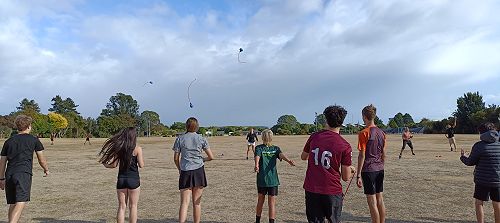 Broadgreen Intermediate and Nayland College students throwing their poi toa as far as they can for teachers to try and catch.