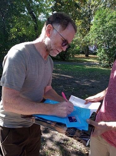 David Howard signs autographs after the City Day reading with Sergei Gogin.
