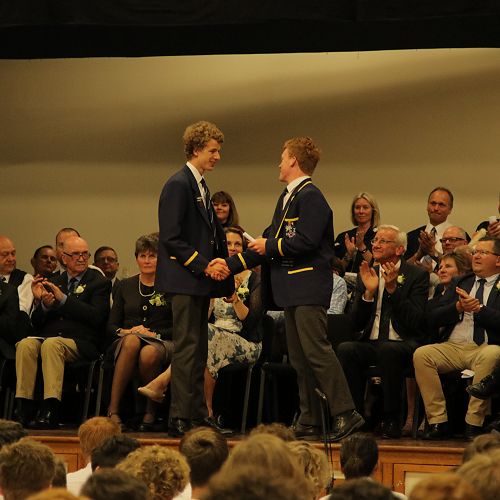 Matthew Gualter being presented his Head Boy badge from 2018 Head Boy Ryan Greenslade