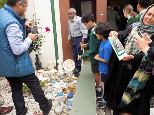 Adam and his brother Eyad helping hand over the gifts.