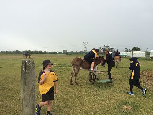 Ella dismounting her donkey.