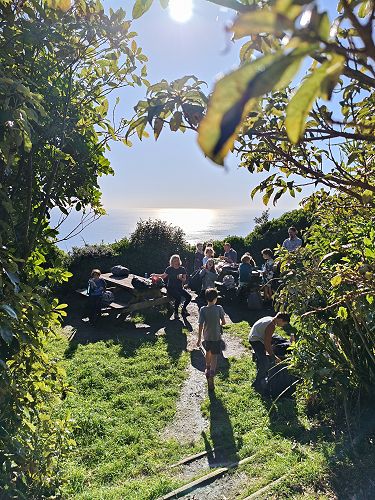 Class 4 students having a break after reaching Kāpiti Island lookout