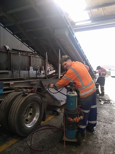 Ryan assisted the team in the pit while servicing a truck as a Diesel Mechanic