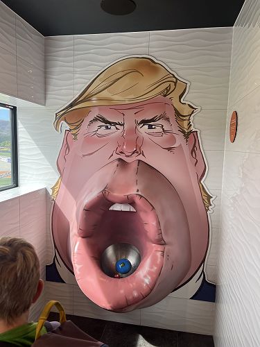 Donald Trump in the boys toilet loo with a view