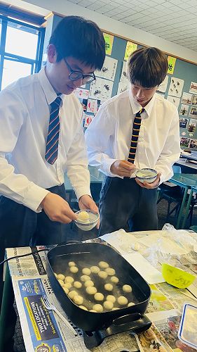 Carefully placing the ball inside the cooking pot