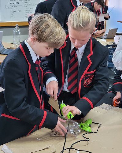 DVC junior students work together to create their rocket.