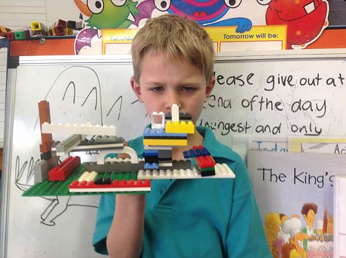 Thomas shares his learning on imagination station at Action Station reflection time.