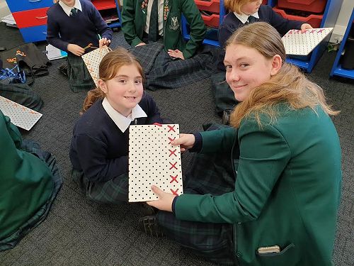 Annabel with her first row of stitching complete