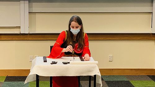 Anise writing calligraphy and painting bird