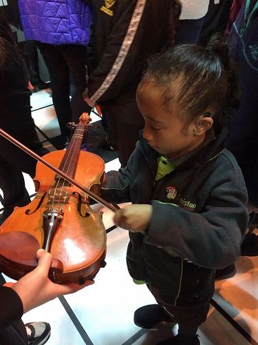 Playing the Violin at the Four Seasons production 