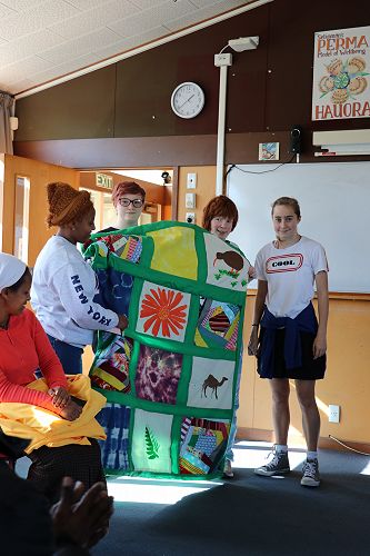 Hellen presented the quilt by Olivia-Rose, Vanessa & Ella