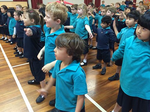 Sam and Zac are getting ready to put on their super hero costumes.