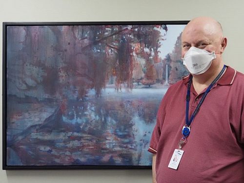 Purpose, hope and meaning. Chaplain Paul Johnston with Anya Sinclair’s Autumn Pond painting in the Wakari Hospital chapel, Dunedin