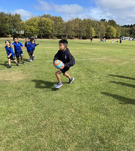 Liam running hard for Columba Tartan
