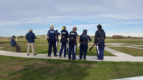 The hostel claybird shooting team train under the watchful eye of coach Ernie Webb.