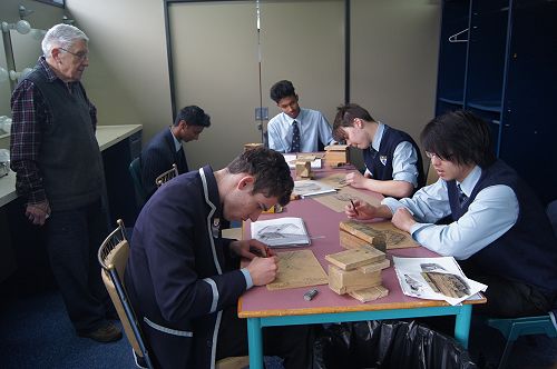 Barry Cleavin works with (clockwise from front left), Jeremy Hastie, Janadhi Dissanayake, Navindu Basnayake, Corey Symon and Taichi Kojima.