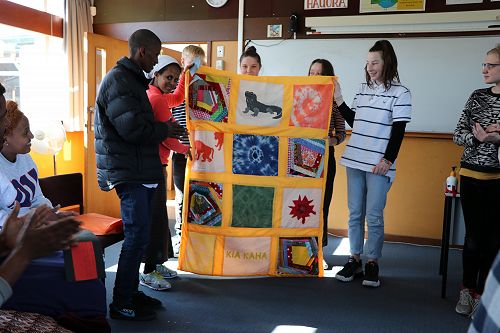 Hunter, Grace, Bronagh & Savanna presenting the quilt to Fishale & Enbeba 