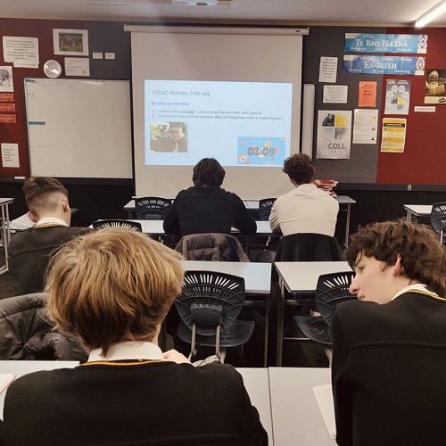 Year 12 students complete their Do Now activities in an English class.