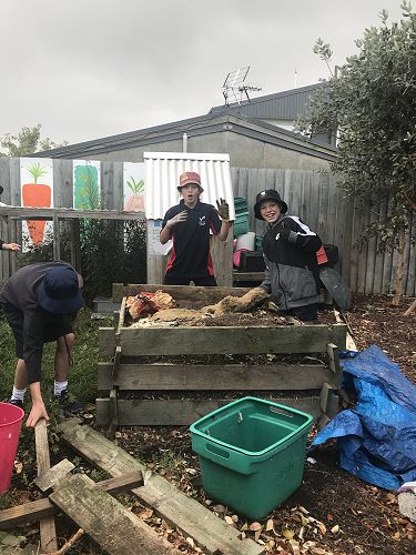Jonah, Cooper and Katie sorting the compost bins out.