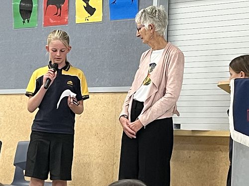 Emma Carson-Iles representing the librarians in thanking Mrs Ross for all her wonderful work at Bluestone