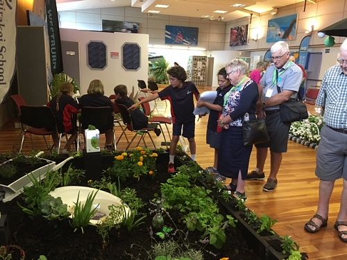 Preston and Anya explaining features of our exhibit to members of the Canterbury Horticultural Society.