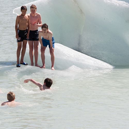 En Watanabe, Angus Frew and Marcus Beagley watch on as their peers swim over. Just a little chilly.