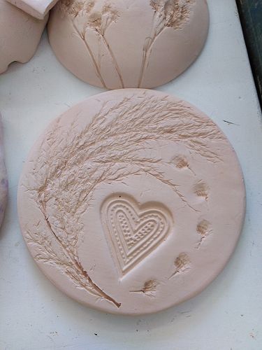 Heaton tribute flowers and Trade Aid heart.