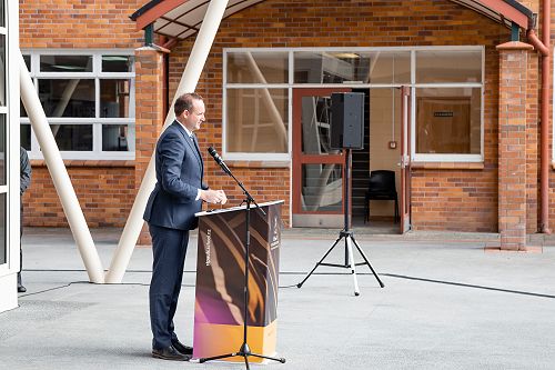 Headmaster Ben Skeen addresses school and attendees