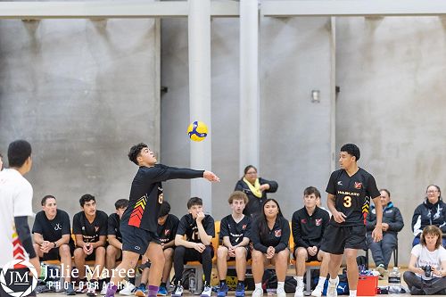 Tamwi and Moses watch on as Hikawera plays the ball