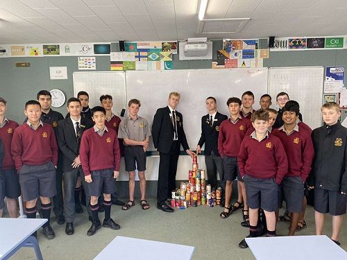 Winning tutor group GD with their pile of donations.