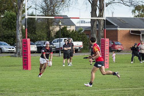 Clearance: Jamayne Feast-Marshall kicks upfield under pressure.