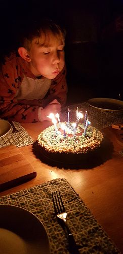 Oscar blowing out the candles on his birthday cake
