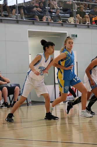 Brenna Lyons in a tight tussle