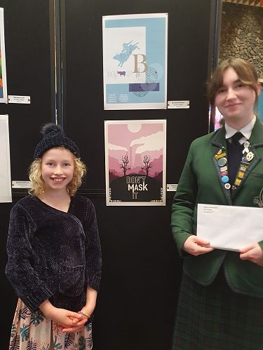 Aidan Forbes and her little sister beside her winning Design "Don't Mask It". 