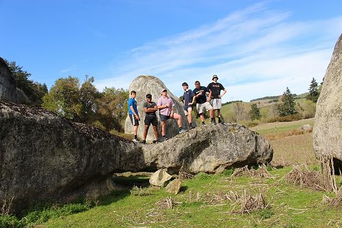 The students enjoying a little rock climbing out at Kakahu.