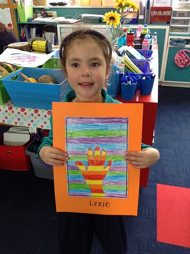 Lexie has used cool colours to surround her hand.
