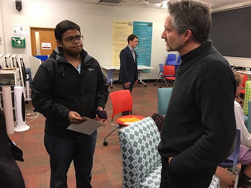 Andrew Wallace speaking with Rahul Sen.