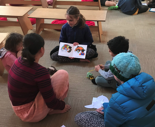 Class 6 reading with Te Reo pukapuka with Class 1