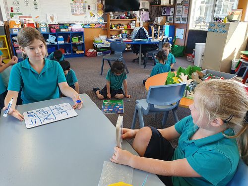 Lexie and Harper playing Basic Facts Bingo