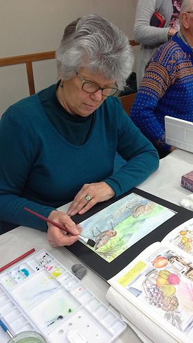 Leonie Tait finishes off her stunning work