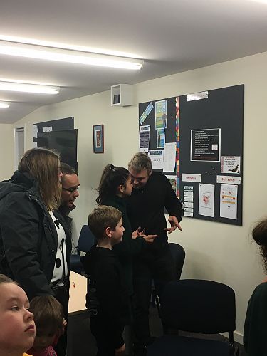 Families at our whānau hui sharing the inquiry that the Māori students completed related to our Cultural Narrative.