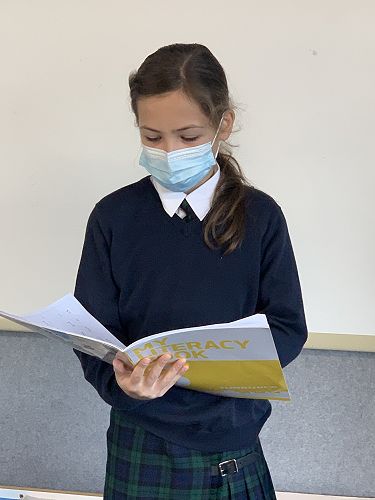 Lucia Garcia sharing her poem with the class.