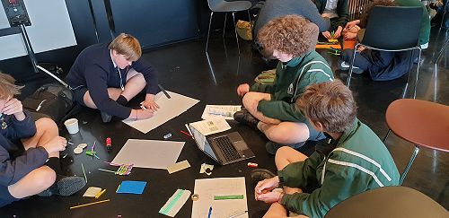 Alex and Sawyer working on their solution.