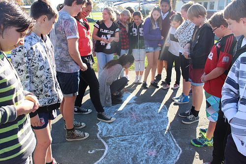 Room 11 add their contributions to the coin trail.