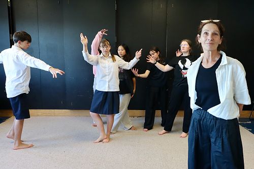 Alison Bruce from Red Leap Theatre leads students through a movement exercise